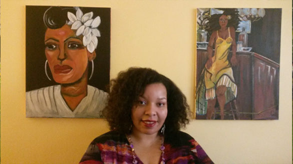 Qiana Watson ’01 in front of her artwork.