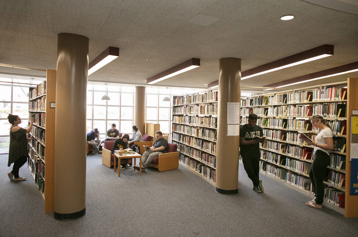 The lower level of the Callahan Library offers comfortable seating by a giant floor-to-ceiling window, as well as plenty of books to choose from.