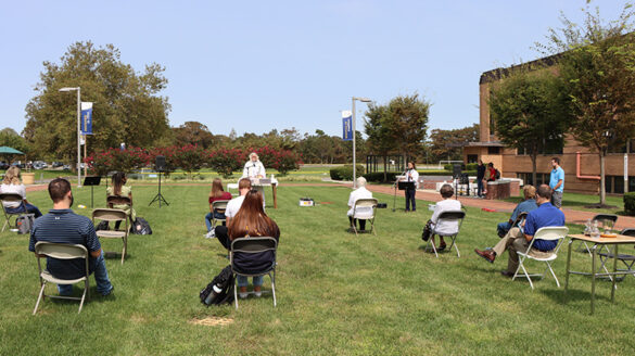 Students, faculty and staff at Mass on the Grass.